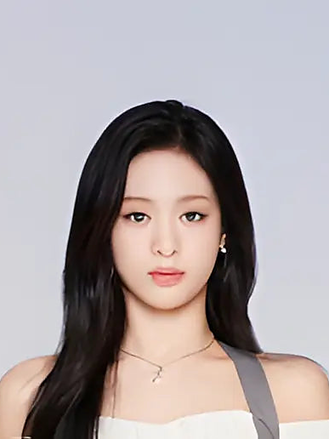 A BABYMONSTER member with long dark hair