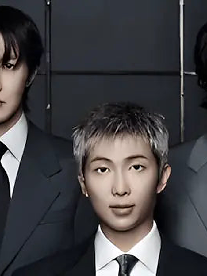 BTS members in dark suits