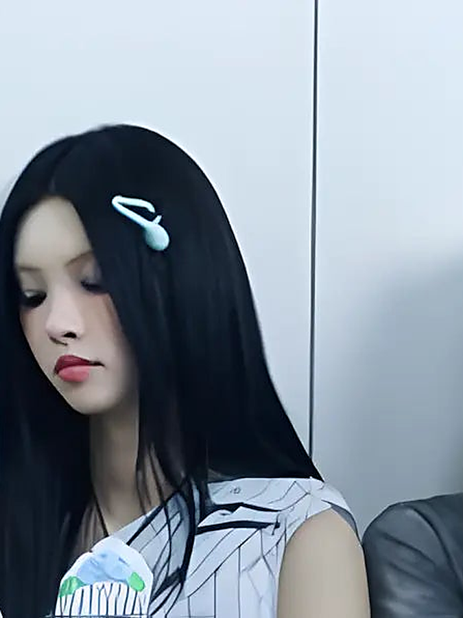 An ILLIT member with a hair clip